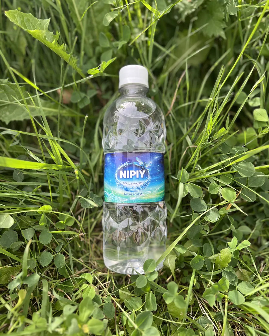 Spring Nipiy bottle lying in clover
